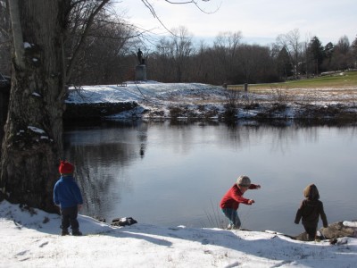 the boys walking down the snowy bank to the Concord River