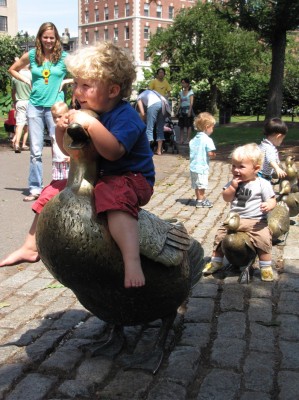 Harvey and Zion riding duck statues