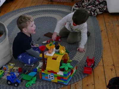 Lijah playing big legos with Liam