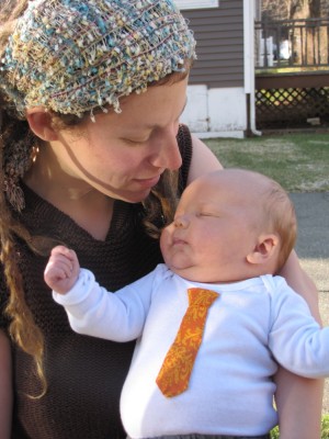 Leah holding LyeLye, who is sporting an orange tie