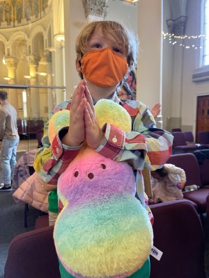 Elijah in church holding his big Easter bunny