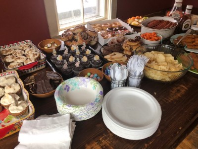 lots of food, mostly desserts, on our kitchen table