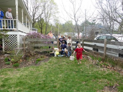 kids rushing into the yard to begin the egg hunt