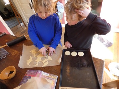 Zion and Elijah cutting out sugar cookies