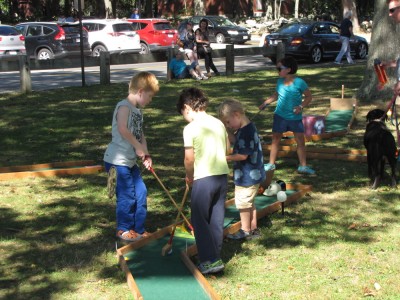 Zion, Nathan, and Julen playing mini golf