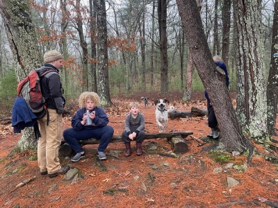 me and boys pausing for a rest and water in the woods