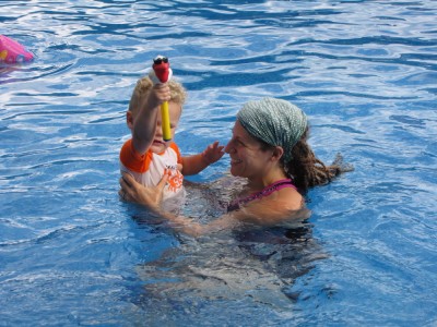 Mama holding Lijah in a pool