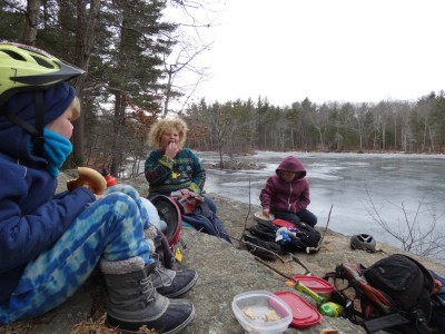 the boys picnicing on the cliff above frozen Fawn Lake