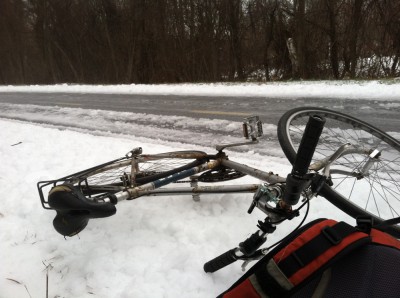 my bike and backpack fallen by the side of the icy bike path