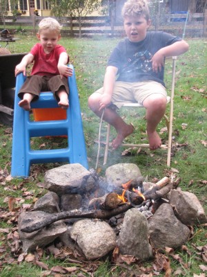 Zion and Harvey sitting by the fire