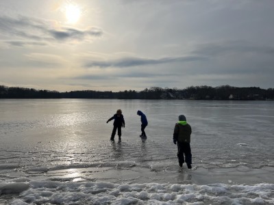 Zion, Elijah, and a friend trying out the ice on Freeman Lake