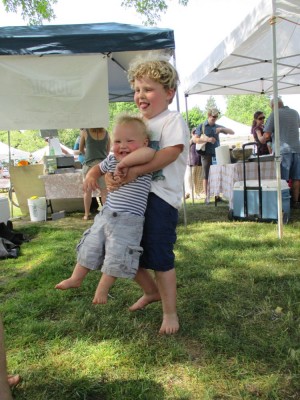 harvey and elijah playing at the farmers market