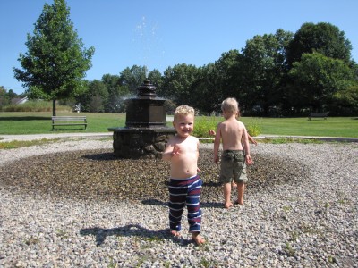 Zion and Lijah playing in a fountain