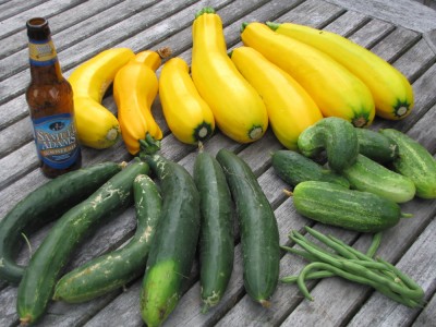 a bunch of vegetables and a beer bottle