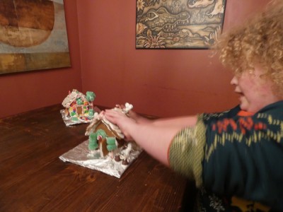 Harvey starting to take apart his gingerbread house