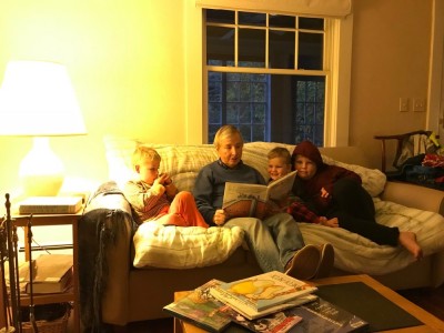 the boys looking at a book with Grandpa David