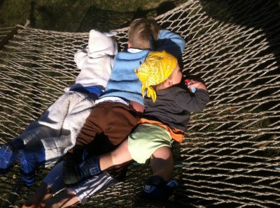 Zion, Harvey, and Lijah in the hammock, in costume