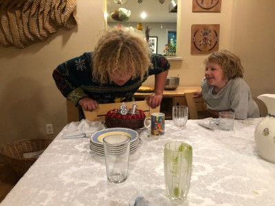 Harvey blowing out the 1 and 3 candles at his cake at Grandma's house