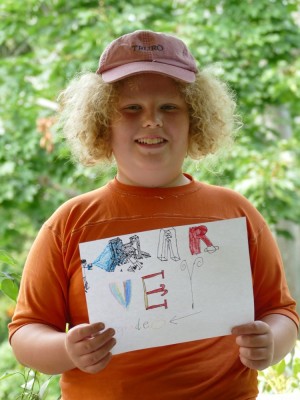 Harvey holding his grade 6 sign