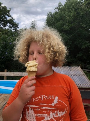 Harvey tasting a cone of his homemade ice cream