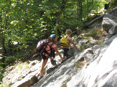 Harvey and Leah climbing rocks