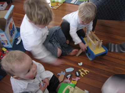Harvey, Zion, and Elijah playing with Elijah's presents