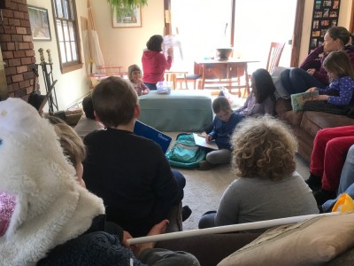 the boys taking part in a class in our friends' living room