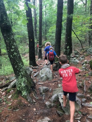 the boys hiking on a rocky trail