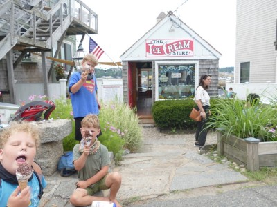 the boys eating ice cream in front of the Ice Cream Shop