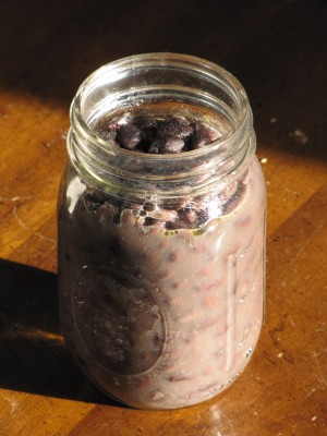 a pint jar of cooked black beans on the table