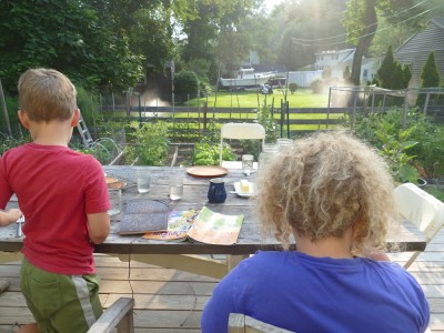Harvey and Elijah breakfasting on the deck