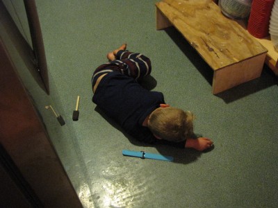 Lijah asleep on the kitchen floor