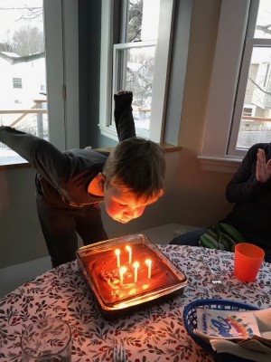 Lijah blowing out candles at Grandma's house