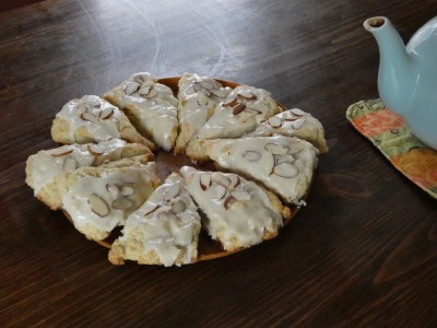 scones with glaze and almonds on top on the table