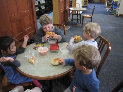 the boys and friends eating lunch at a table in the Billerica library