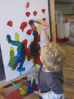 Lijah painting at the easel