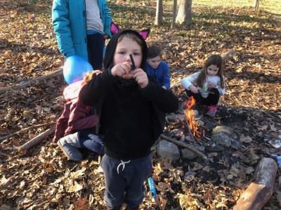 Elijah playing with a firelighter