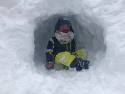 Elijah sitting in a snow cave