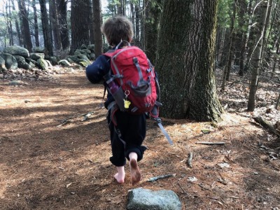 Elijah hiking barefoot, with muddy feet