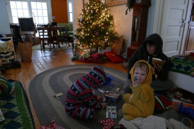 the boys opening presents in the semidarkness