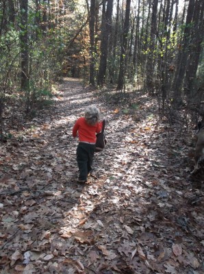 harvey carrying his treasure bag through the woods
