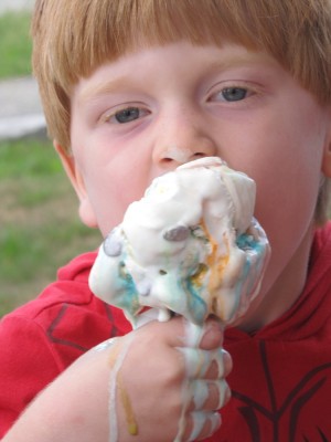 Nathan eating a giant ice cream cone, which is melting badly