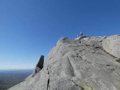 Zion and Elijah far ahead on the rocky upper slopes of Monadnock