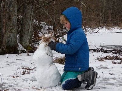 Elijah working on a little snowman