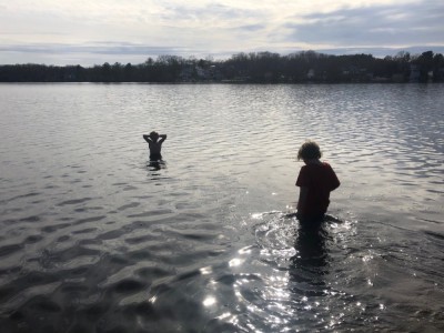 Elijah and Zion wading deeply in Freeman Pond