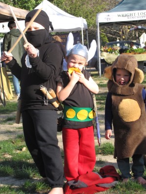 ninja Harvey, Asterix Zion, and monkey Lijah posing at the farmers market