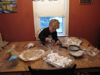 Harvey at the kitchen table slicing marshmallows