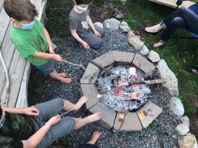 several marshmallows toasting over our fire