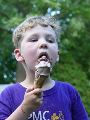Elijah licking a chocolate ice cream cone