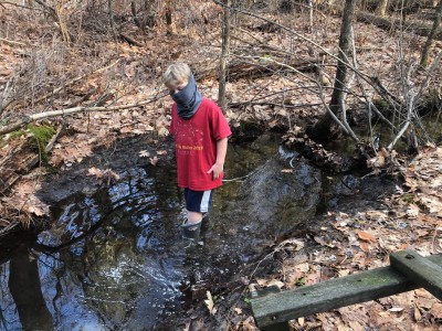 Zion standing in a stream
